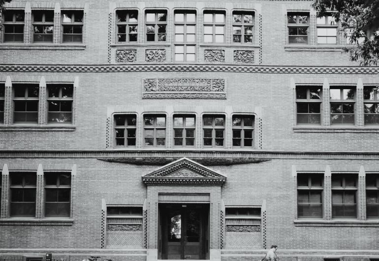 Black and white image of the front of a university building