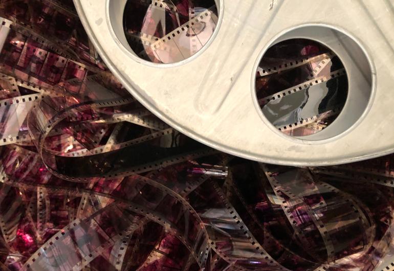 Close up of a film reel with loose film in a mass