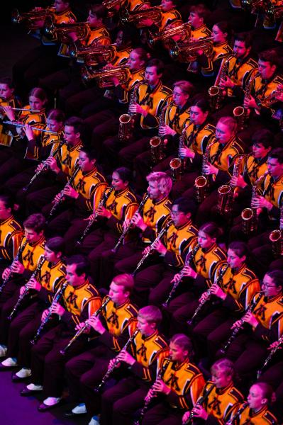 UMN Marching Band assembled in rows, seen from above.