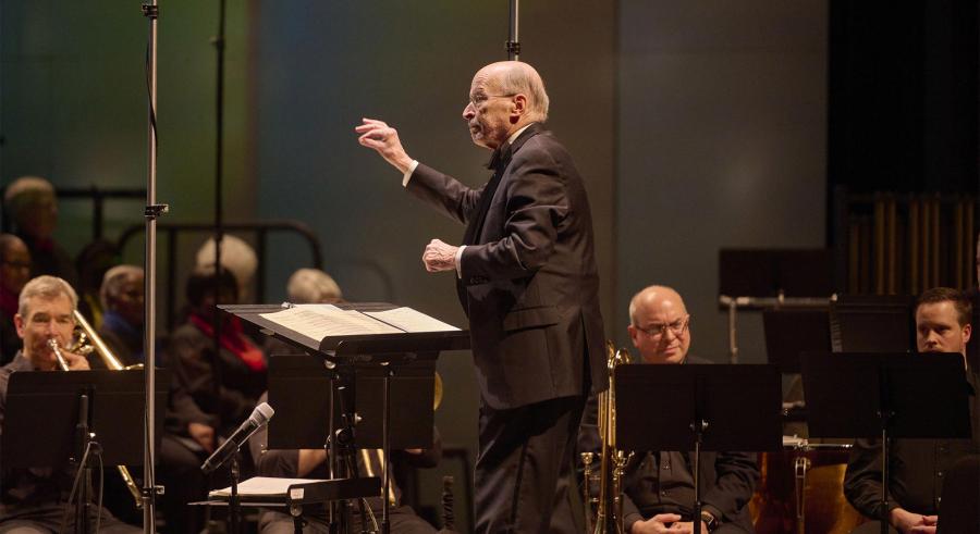 Philip Brunelle conducts musicians at Northrop