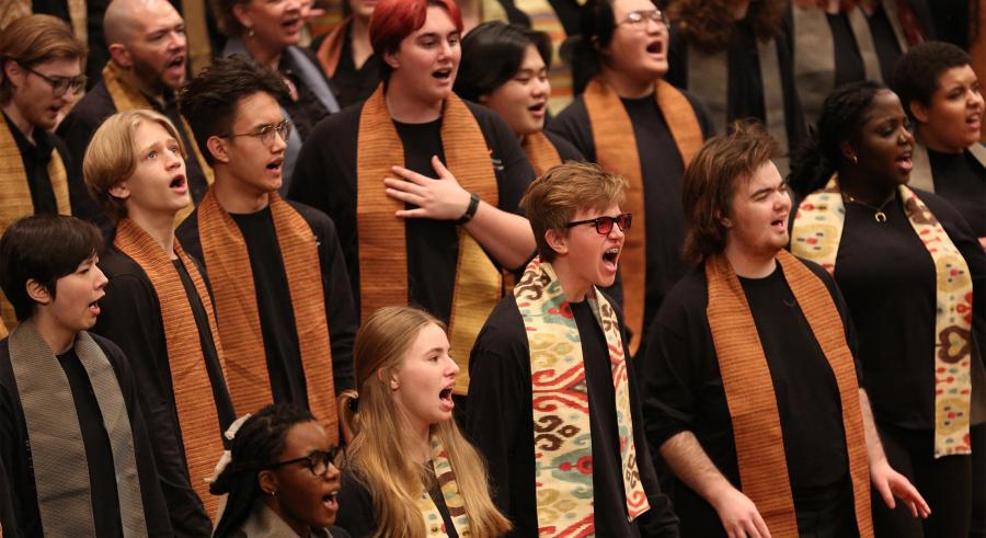 VocalEssence chorus wearing brown stoles.