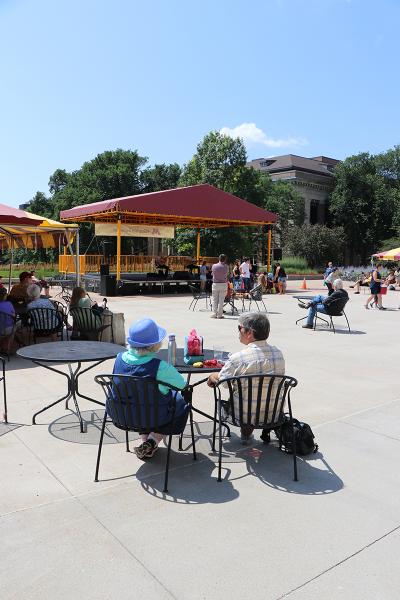 The lunchtime crowd listens to Tim Sparks and Phil Heywood at Northrop's Music on the Plaza.
