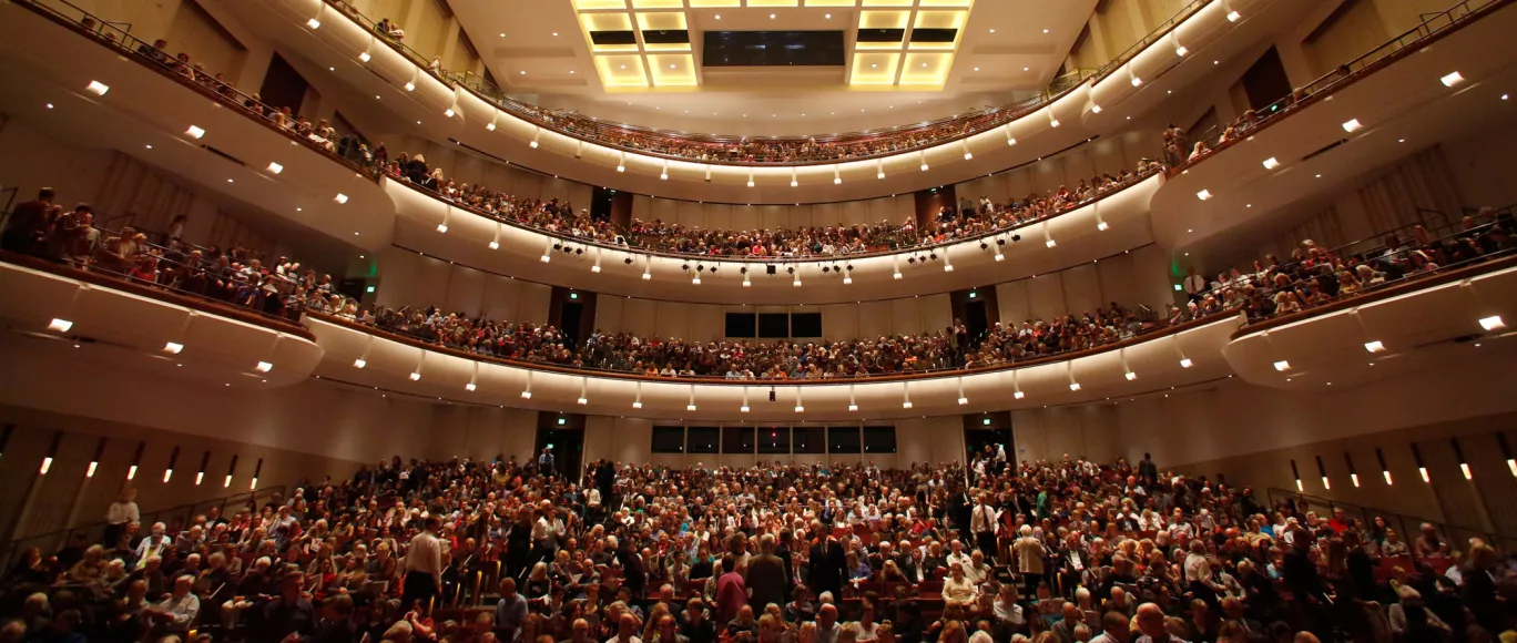 Interior view of an audience inside the Carlson Theater at Northrop