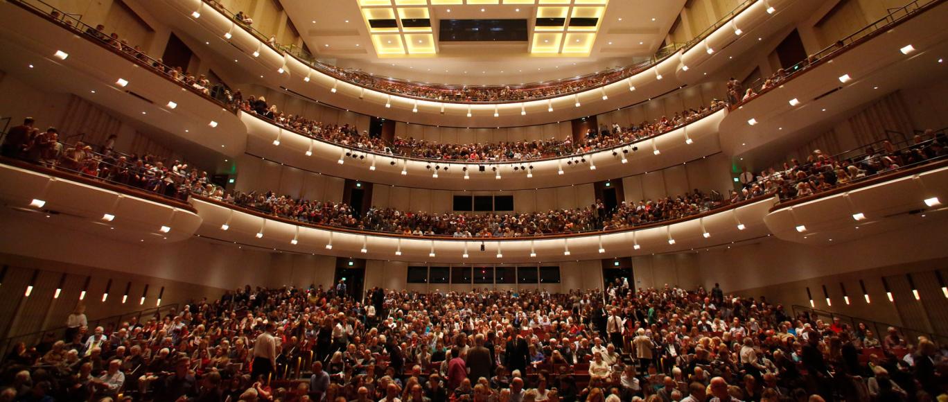 Interior view of an audience inside the Carlson Theater at Northrop