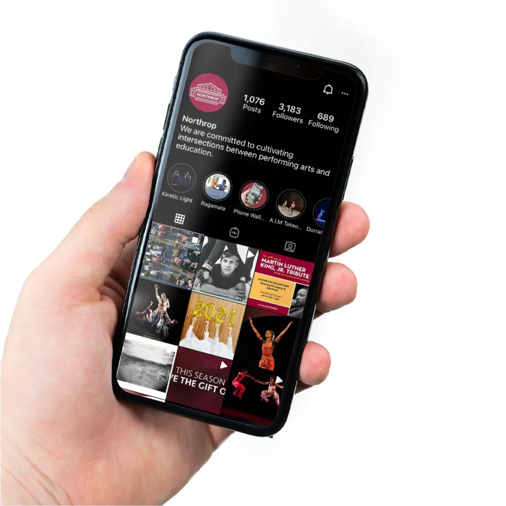 Hand holding phone with Northrop's Instagram page on the screen.