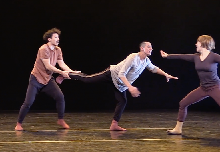 3 dancers, reaching and pulling