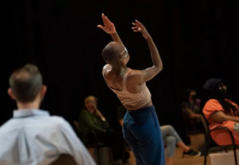 Dancer performs among the audience members