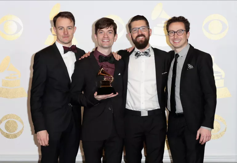 Third Coast Percussion posing with their Grammy.