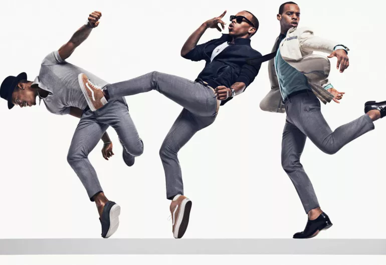 Lil Buck posing in various outfits and movements for GQ.