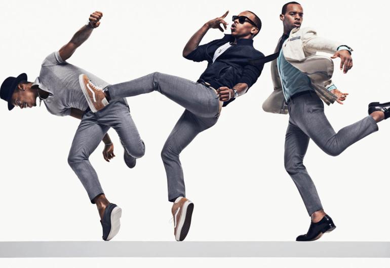 Lil Buck  posing in various outfits and movements for GQ.