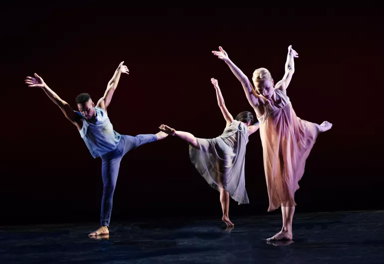 3 Limon dancers in arabesque with arms up