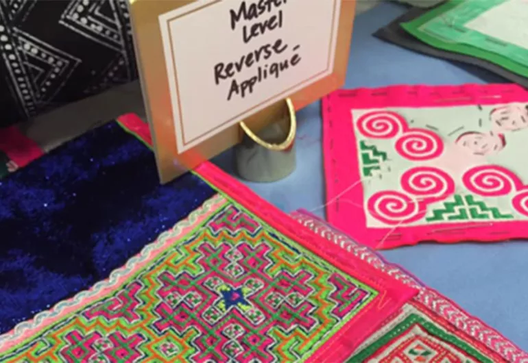 Textile display - with sign "Master Level Reverse Applique"