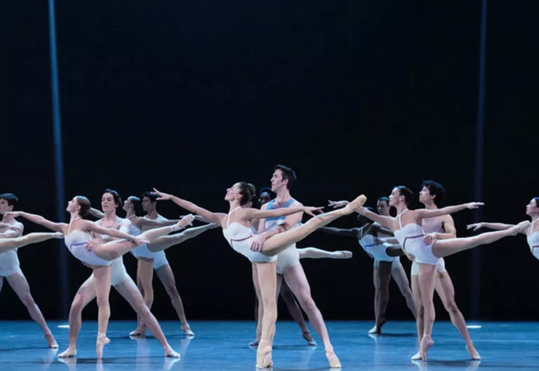 Company in pairs on stage