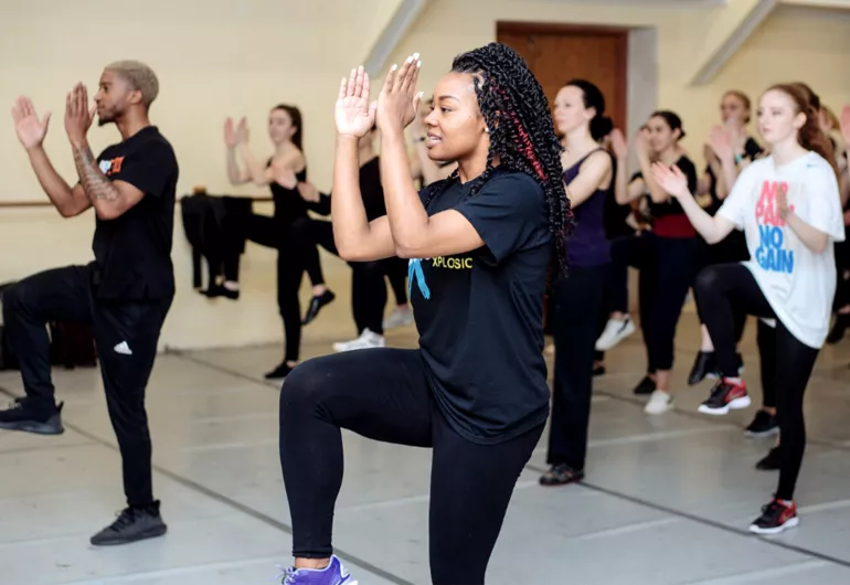 A group of people participate in a dance class