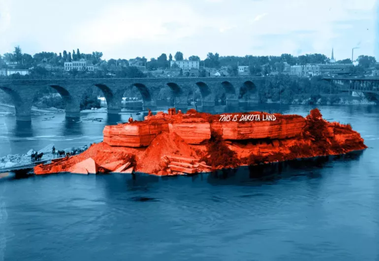 A blue monochrome image the Stone Arch Bridge in the Mississippi River with an island highlighted in red with the words "This is Dakota land' written on it.