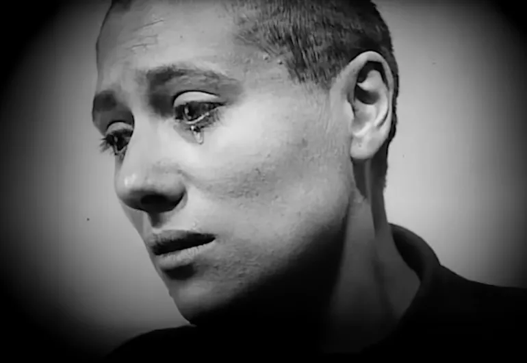 Maria Falconetti, a woman with a shaved head, cries in the film “The Passion of Joan of Arc.”