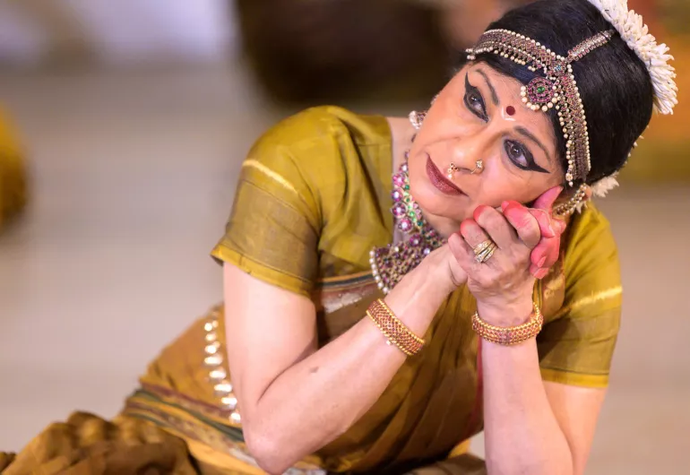 Ranee Ramaswamy presses her hands to her cheek.