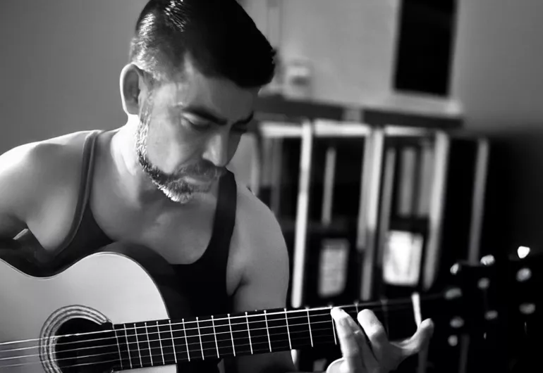 Alvaro Bermudez plays guitar. Link to YouTube video of Seraphic Fire performing Danzas del Silencio.