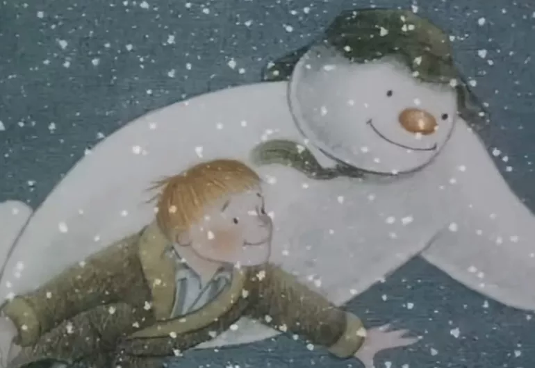A cartoon snowman and blonde-haired boy flying through the snowy air.