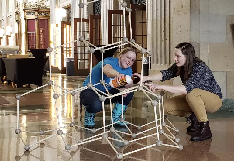 Students build a large model of a molecule 