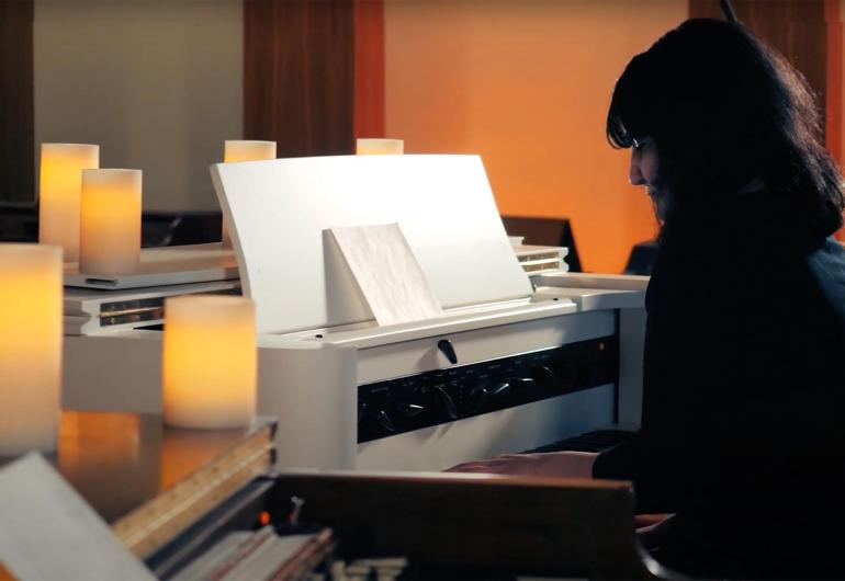 Video still of Sarah Davachi playing the piano