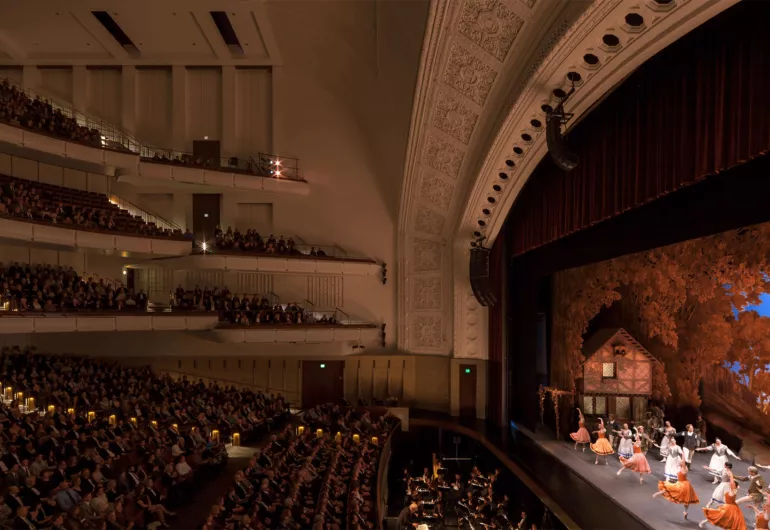Audience and performers in the newly renovated Interior of the Carlson Family Stage
