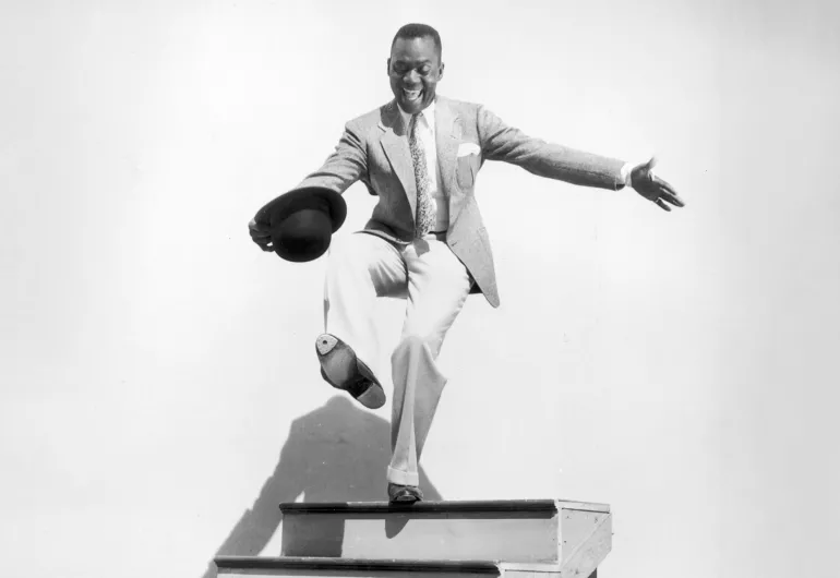 Bill Robinson dances on stairs