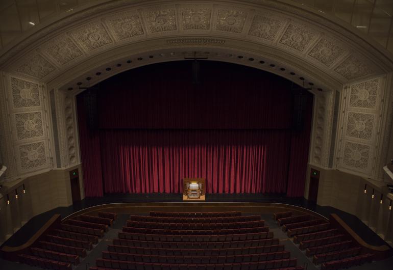 A view from the upper balcony with the pipe organ on center stage.