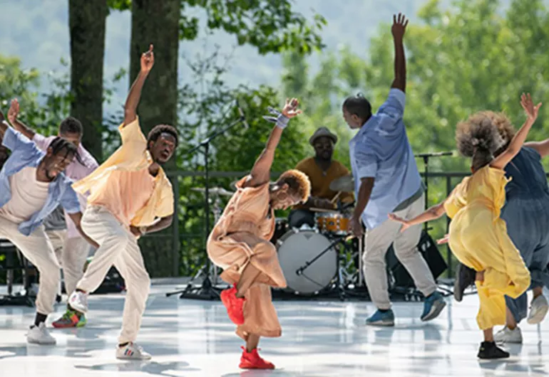 Dancers performing on an outdoor stage