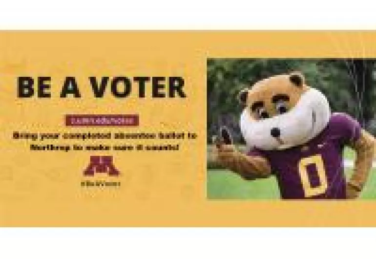 U of MN Mascot Goldie Gopher on the plaza in a football jersey giving the peace sign to the camera. And Words on the left that say "Be A Voter"