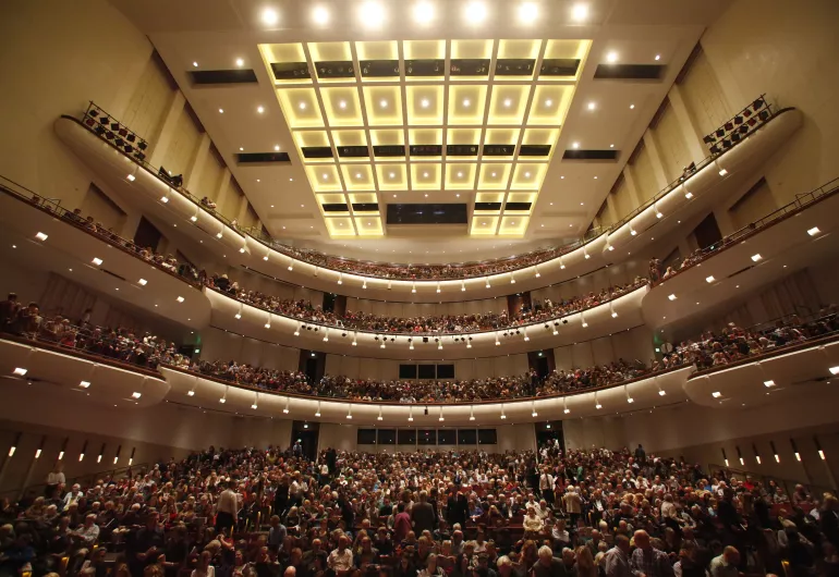 Interior view of an audience inside the Carlson Theater at Northrop