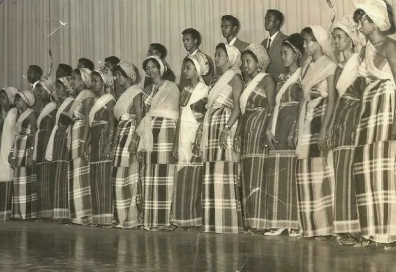 Vintage photograph of a group of people standing on stage