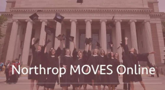 Graduates standing in front of Northrop hall