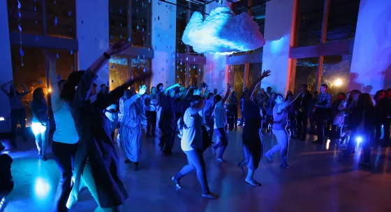 People dancing in a dark room