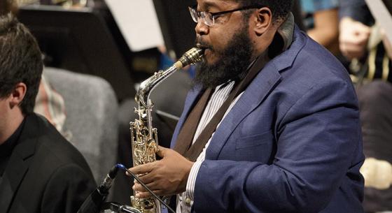 Christopher Rochester playing a saxaphone