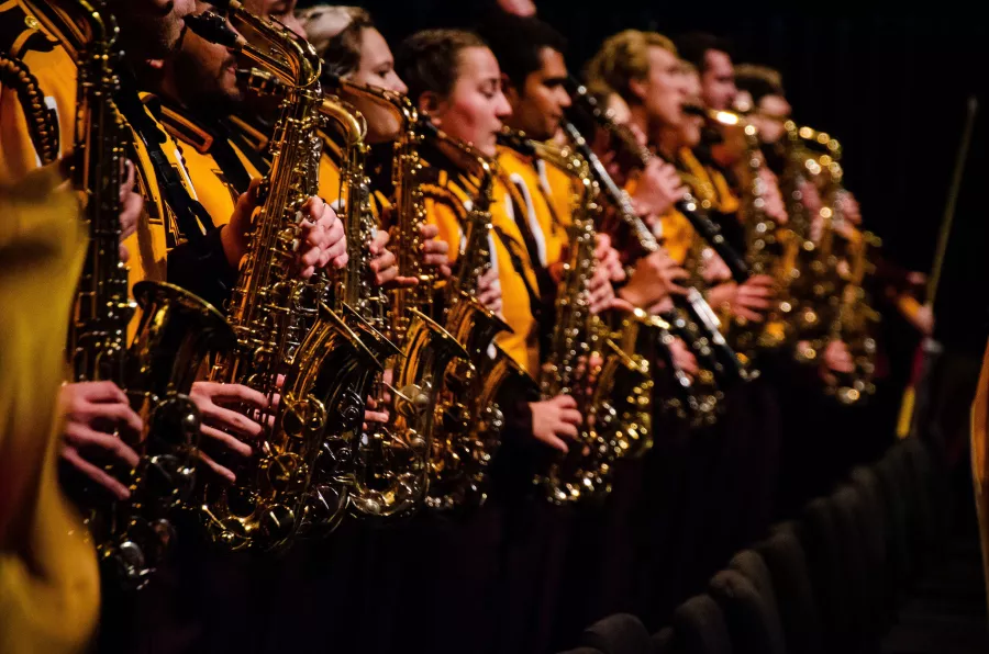 Marching Band members playing saxophones.