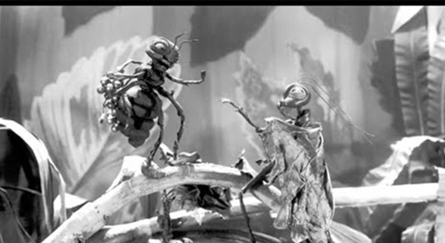 A black and white image shows two bug-like creatures standing towards one another in a natural environment with branches and leaves.