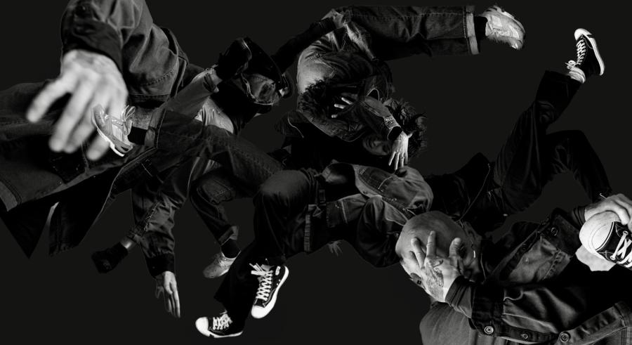 A black and white image shows a collage of overlapping hands and converse sneakers in motion.