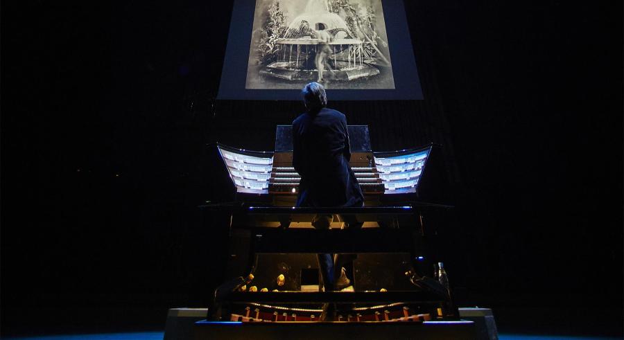Picture of the film projected above the organist as he plays. 