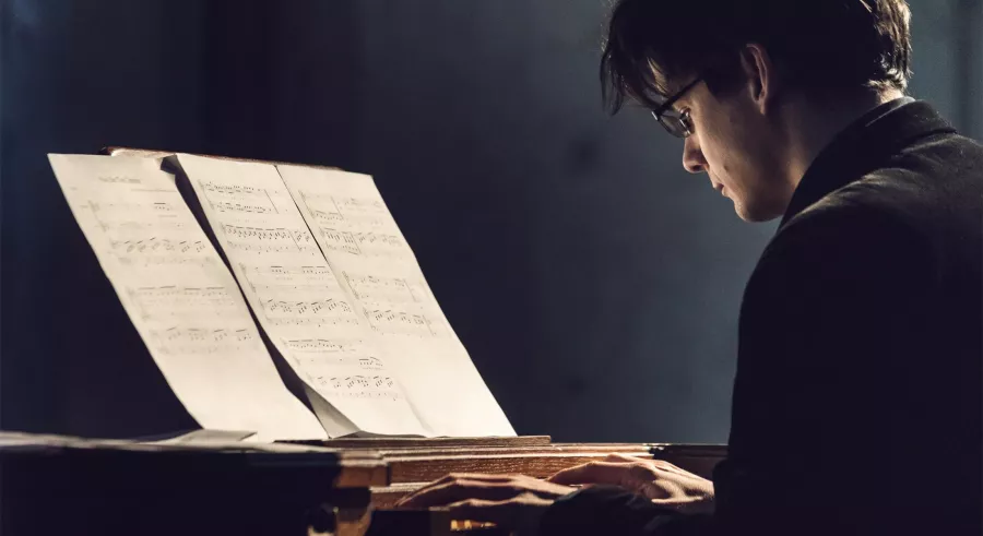 Filip Presseisen examines sheet music.