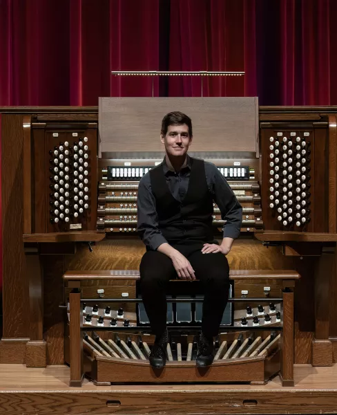 Greg Zelek sits on the bench of the Northrop organ
