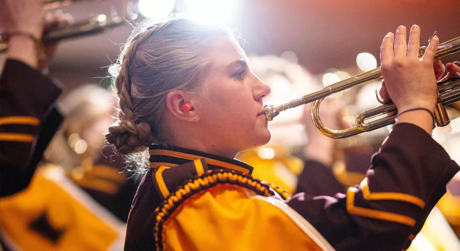 Trumpeteer wearing UMN Marching Band uniform