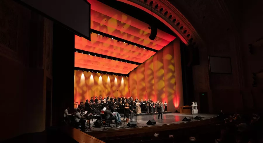 Carlson Family Stage lit red in the dark theater.