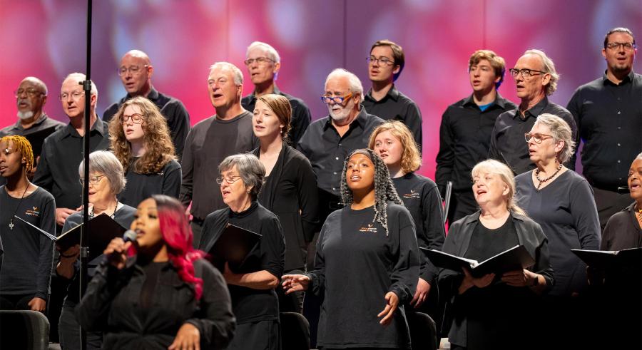 VocalEssence chorus sings behind a soloist.