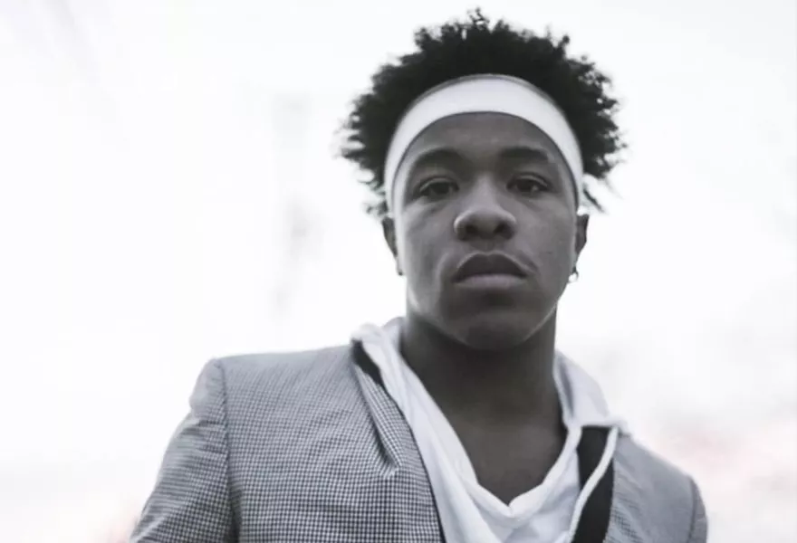 Black and white image of DeTrell Melodies in a white head band