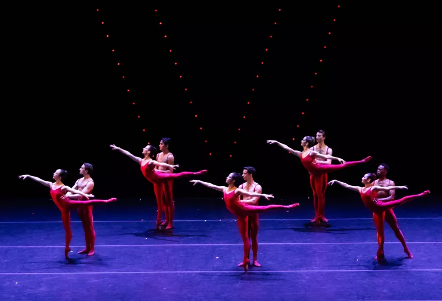 Image of ballet company in five pairs performing on stage.