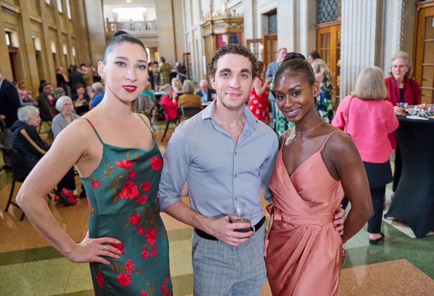 Group photo of artists attending Encore Gala stand together, smiling.