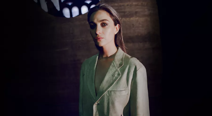 Kali Malone wearing a light green blazer.