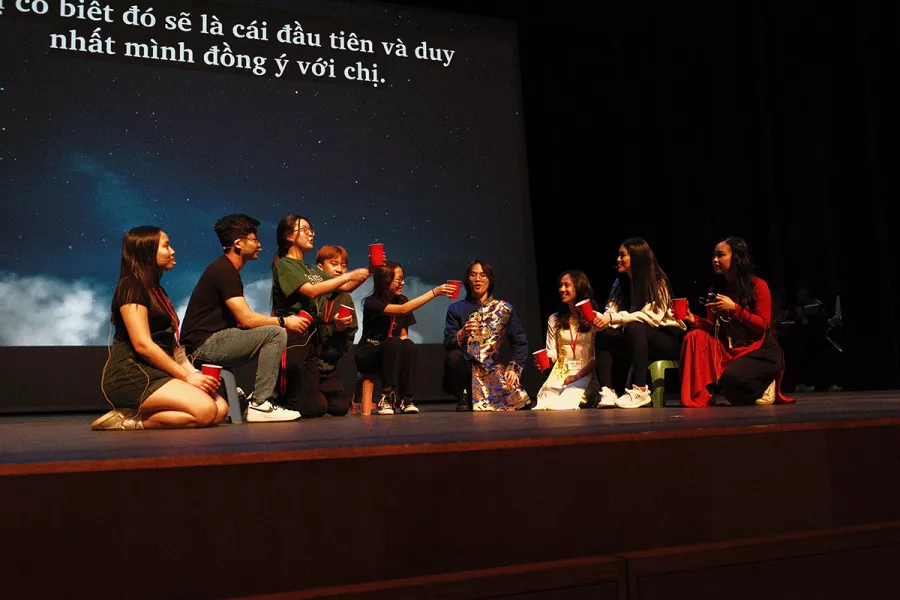 people sit on stage