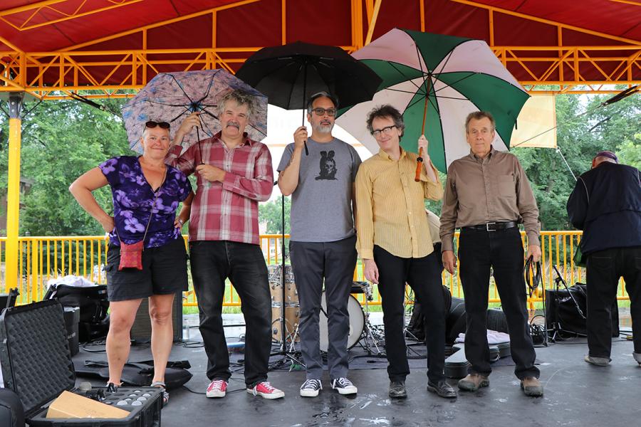 The Fragrants final bow on stage under umbrellas